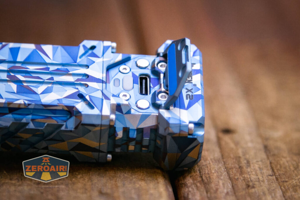 Wuben X-2 Owl Titanium flashlight e-switch detail under cover