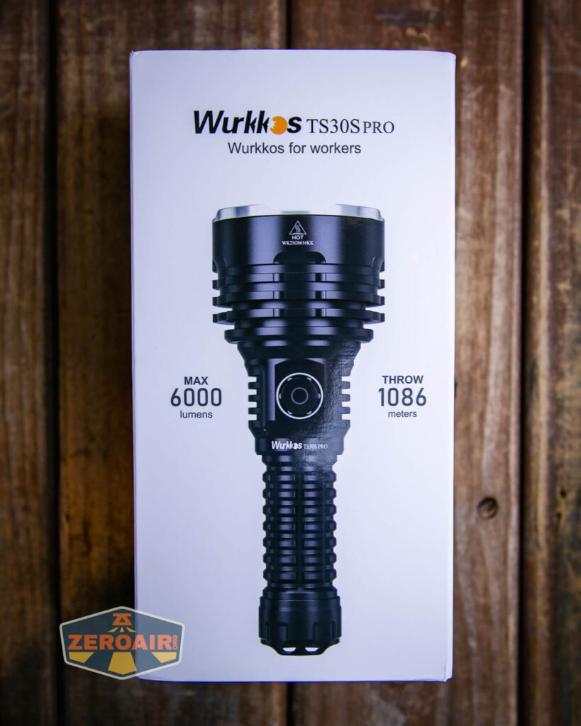 A box displaying the Wurkkos TS30S PRO flashlight, with text indicating MAX 6000 lumens and THROW 1086 meters, and the slogan Wurkkos for workers printed above the image of the flashlight.