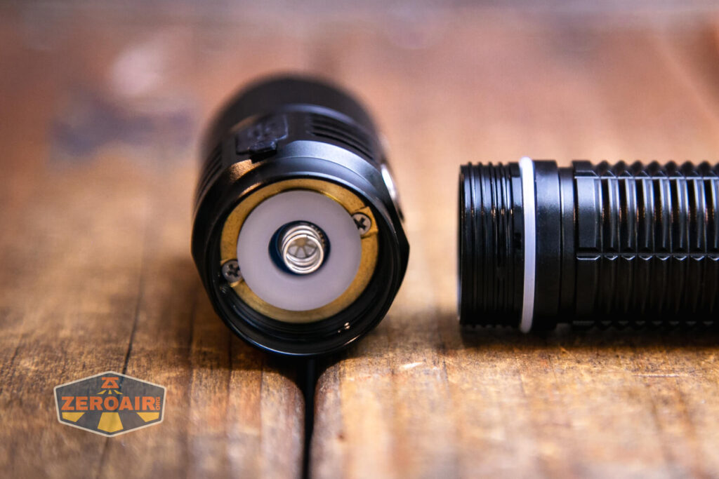 Soonfire MX75 flashlight showing head contacts and threads