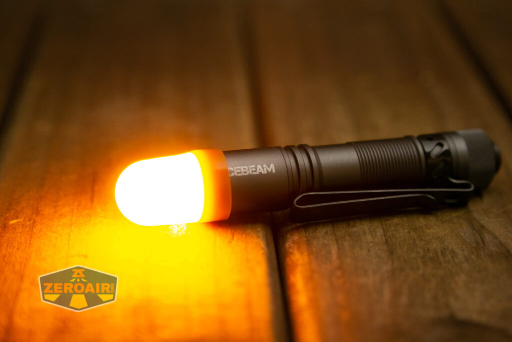 Acebeam Pokelit AA Gray flashlight emitter on with orange diffuser
