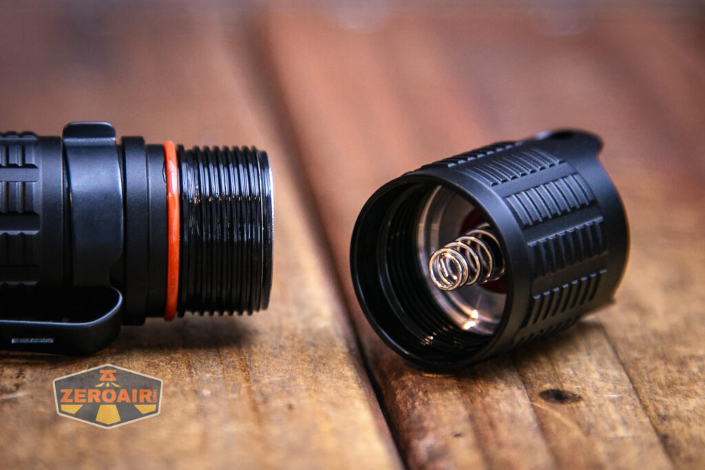 JETBeam BC20 TAC tactical flashlight tailcap off showing spring and threads
