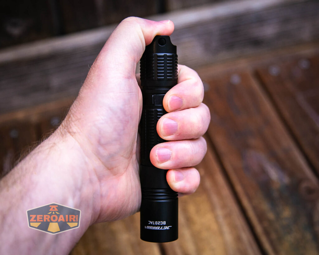 JETBeam BC20 TAC tactical flashlight in hand