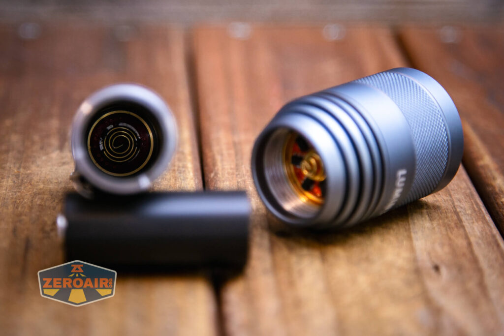 Lumintop FW21 X9LS flashlight showing tail spring