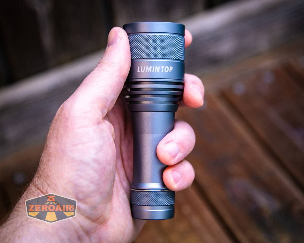 Lumintop FW21 X9LS flashlight in hand