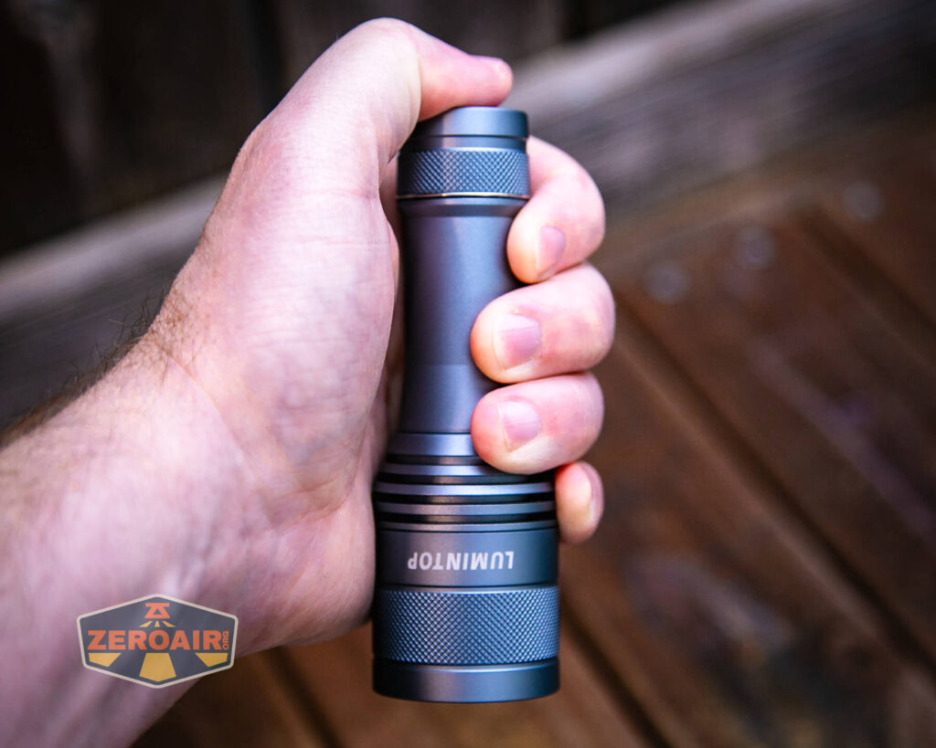 Lumintop FW21 X9LS flashlight in hand