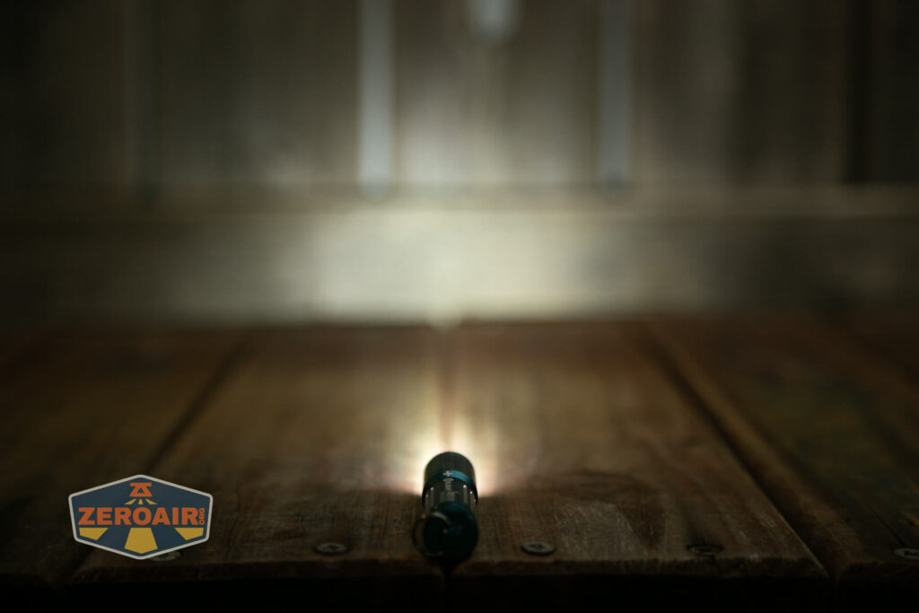 Olight i3E EOS AAA flashlight emitter on
