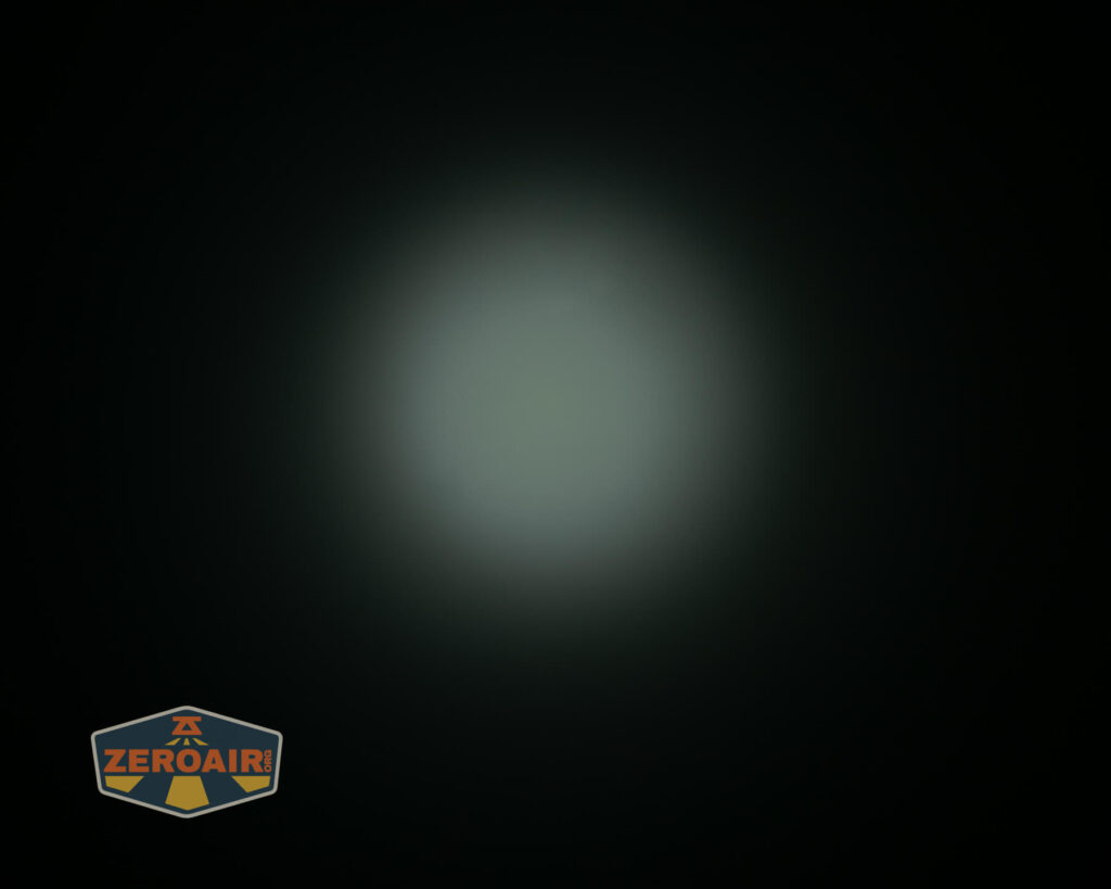 Olight i3E EOS AAA flashlight beamshot on ceiling