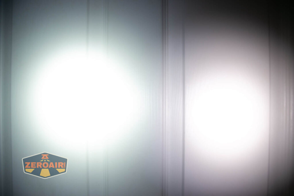 Olight i3E EOS AAA flashlight beamshot on door compared to nichia 219b