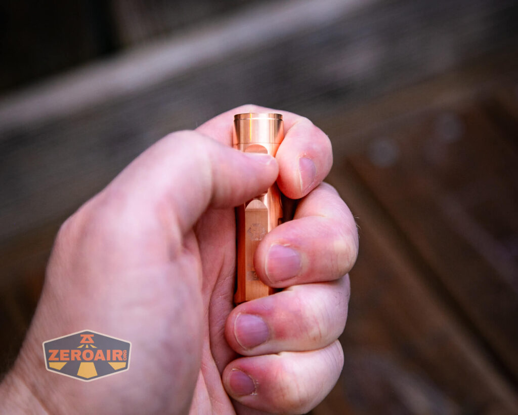 RovyVon Aurora A9 Pro Copper flashlight in hand
