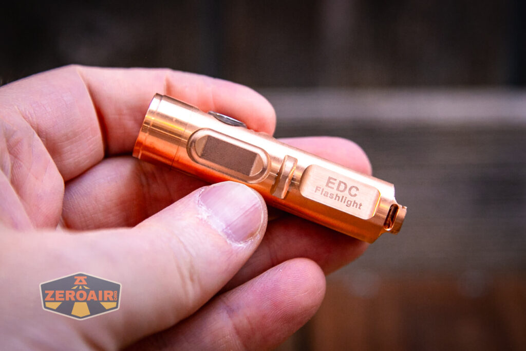 RovyVon Aurora A9 Pro Copper flashlight in hand