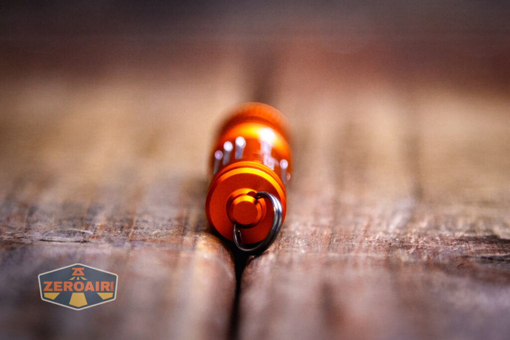 Olight i3E EOS Orange flashlight showing tail