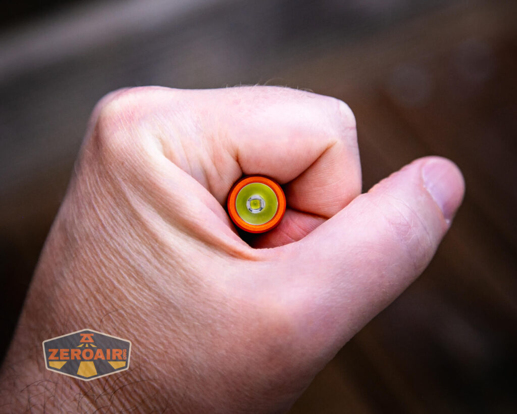 Olight i3E EOS Orange flashlight in hand