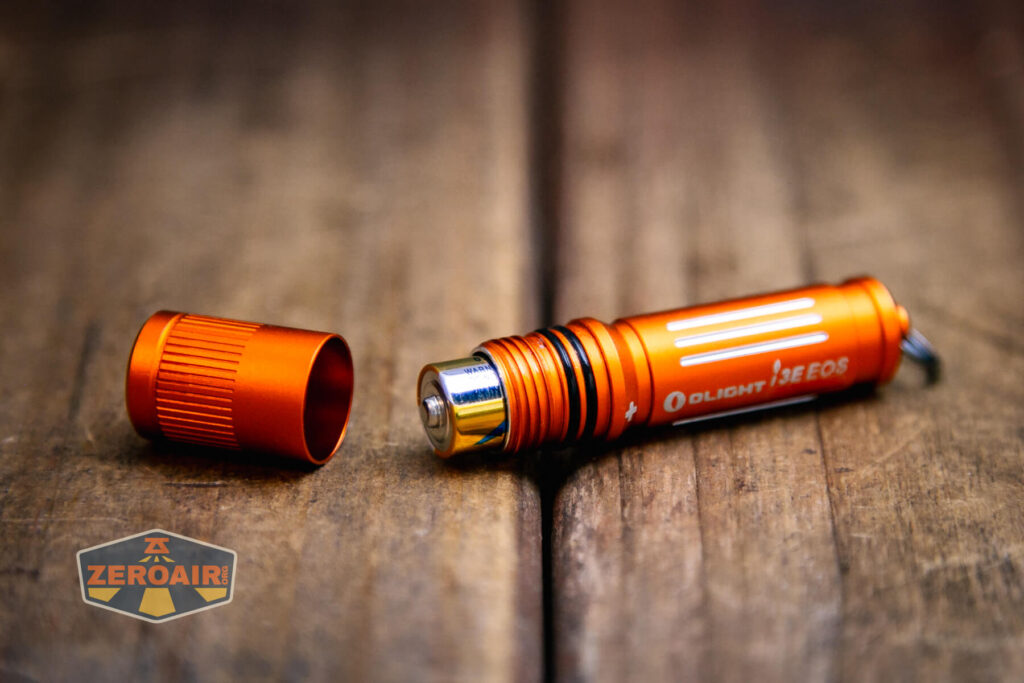 Olight i3E EOS Orange flashlight with cell installed
