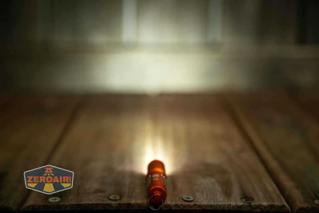 Olight i3E EOS Orange flashlight beamshot