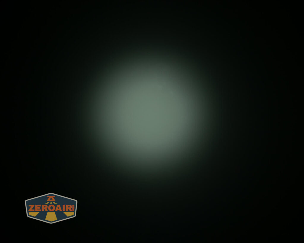 Olight i3E EOS Orange flashlight beamshot on ceiling