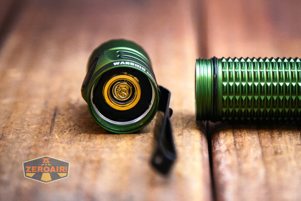 Olight Warrior Mini 3 flashlight showing contacts on head