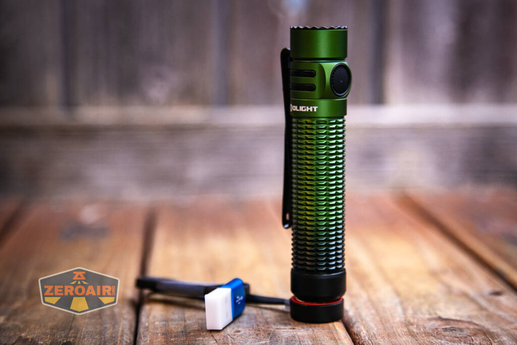 Olight Warrior Mini 3 flashlight charging base in use