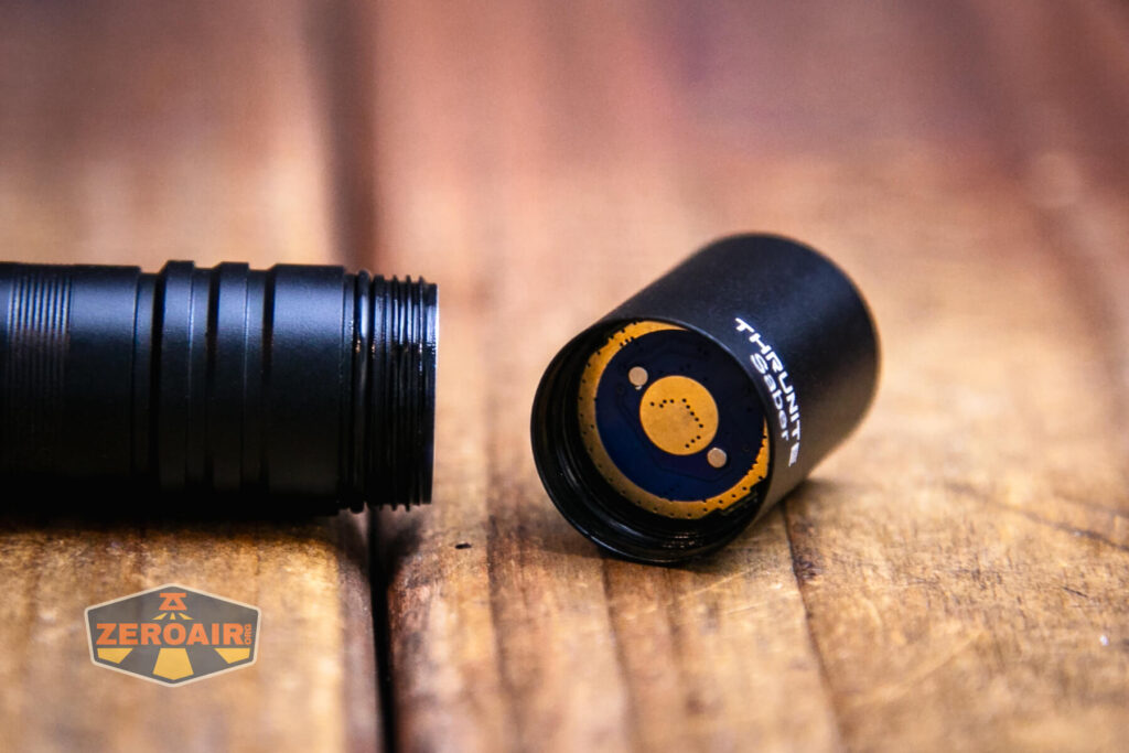 Thrunite Saber EDC pocket flashlight showing head contact