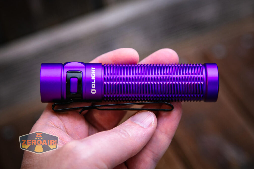 Olight Baton 3 Pro Max purple flashlight in hand