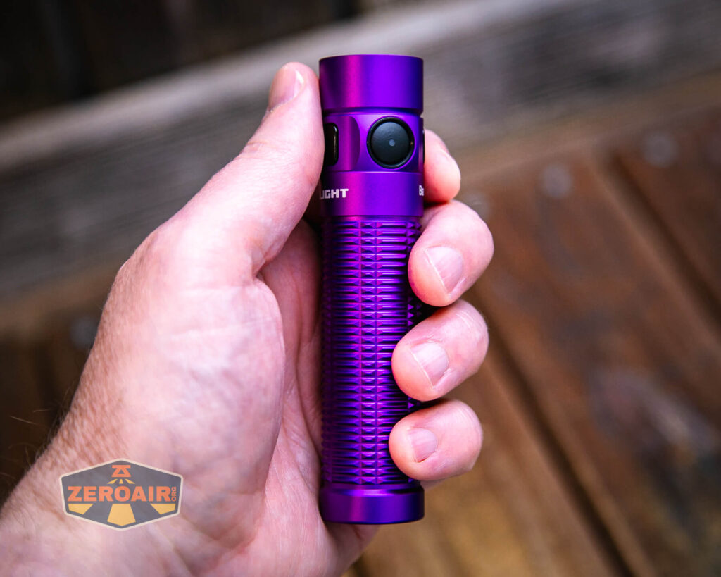 Olight Baton 3 Pro Max purple flashlight in hand