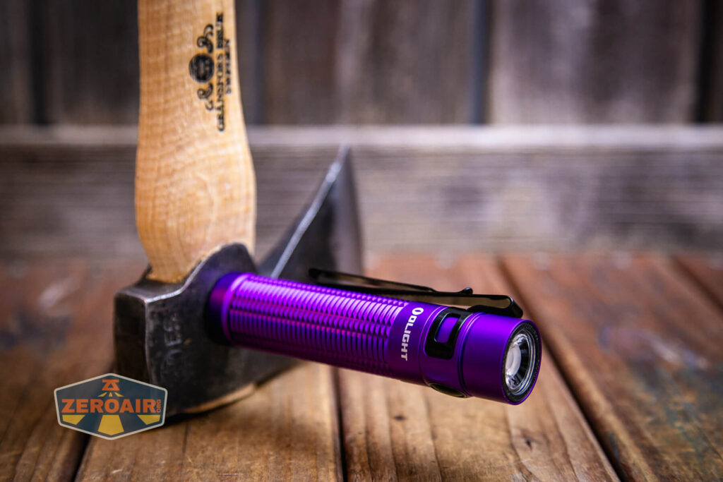 Olight Baton 3 Pro Max purple flashlight magnet in use