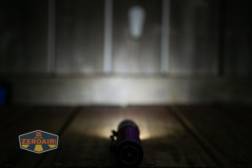 Olight Baton 3 Pro Max purple flashlight emitter on