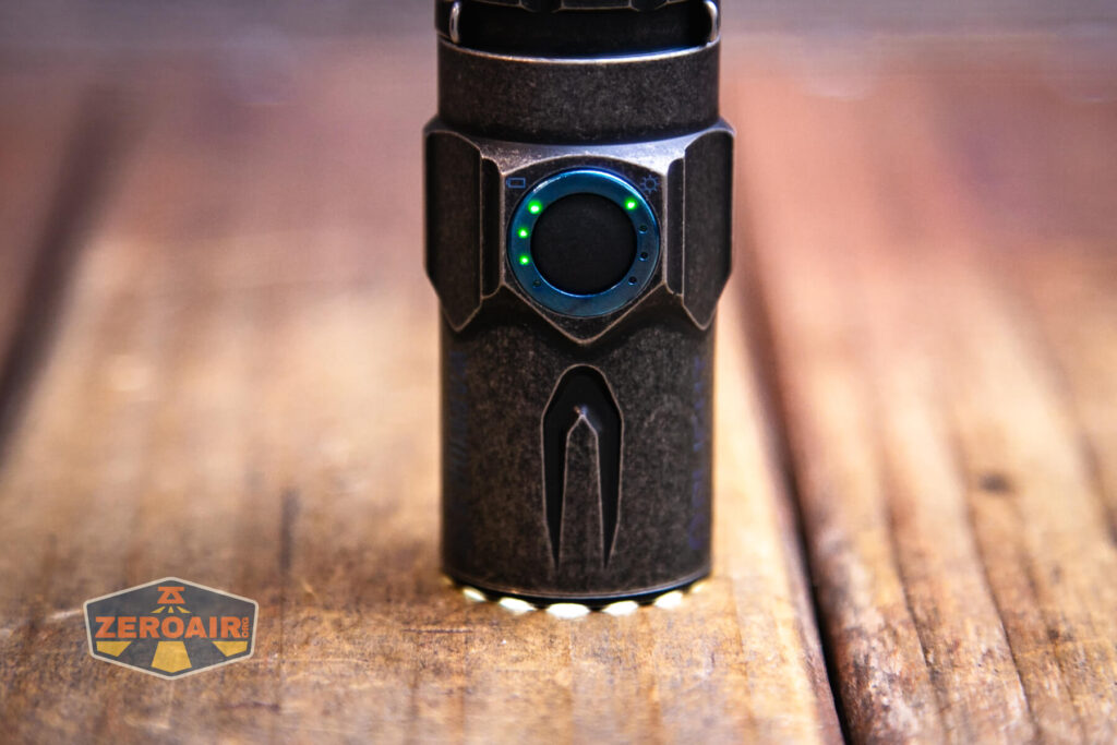 Olight Warrior 3S stonewashed titanium toothed bezel with mode led active too