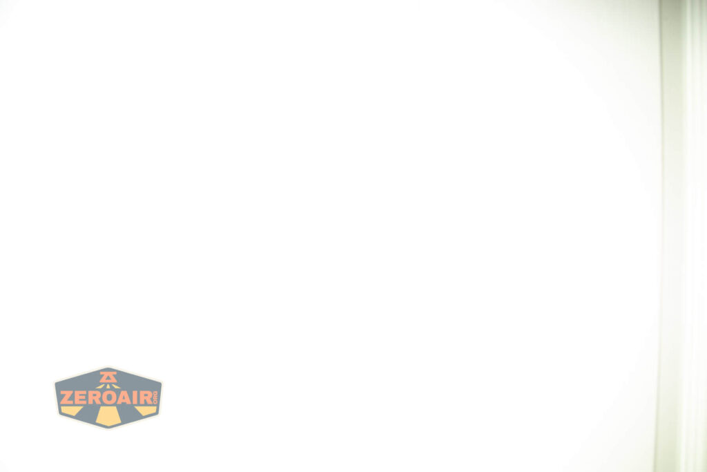 A mostly white image with a faint vertical line on the right and a small ZeroAir logo in the bottom left corner.