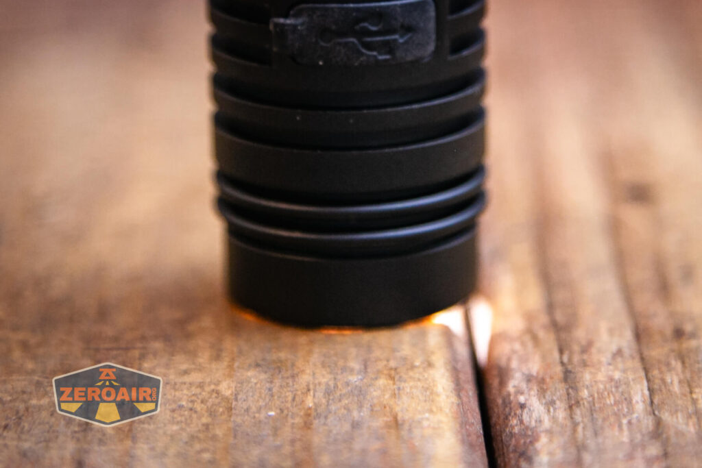 Wurkkos FC13s flashlight emitter on and headstanding