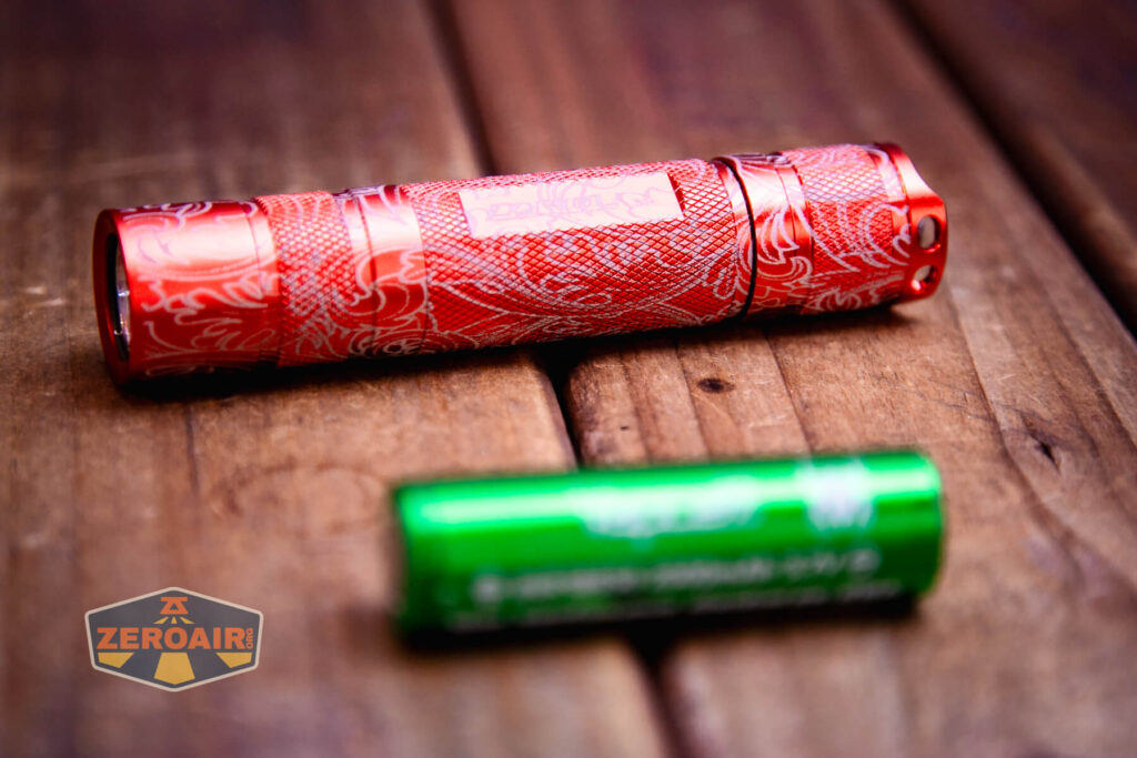 Scrollwork engraved Convoy S2 flashlight with 18650