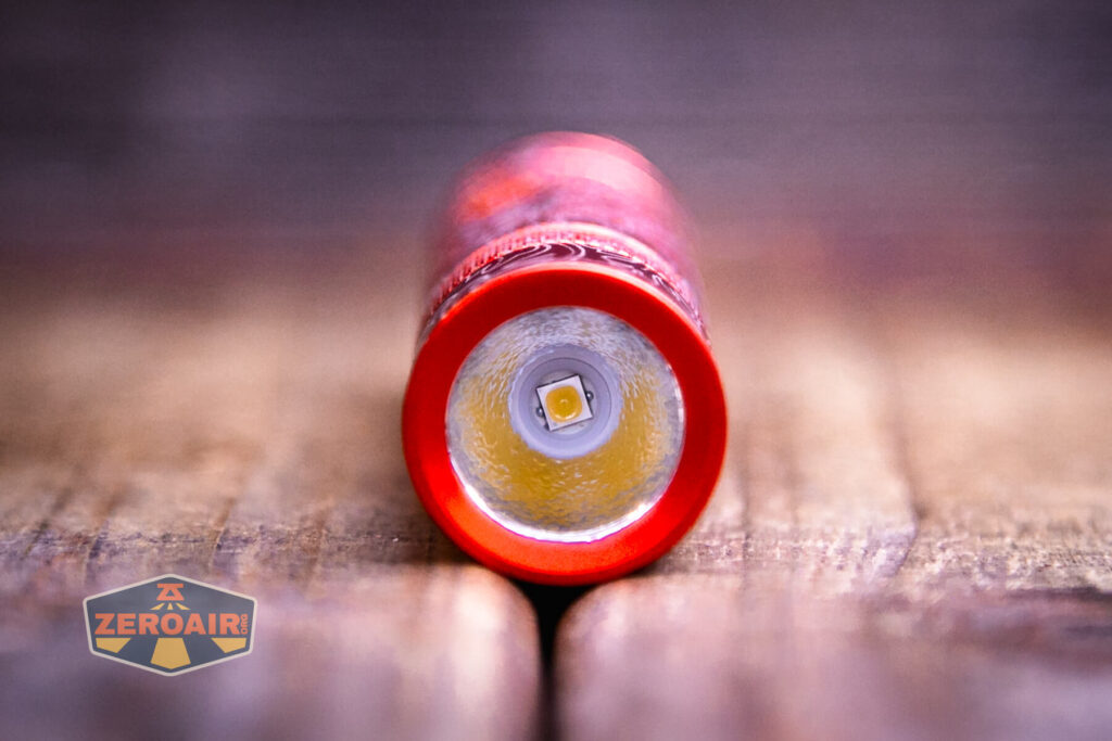 Scrollwork engraved Convoy S2 flashlight emitter and optic 