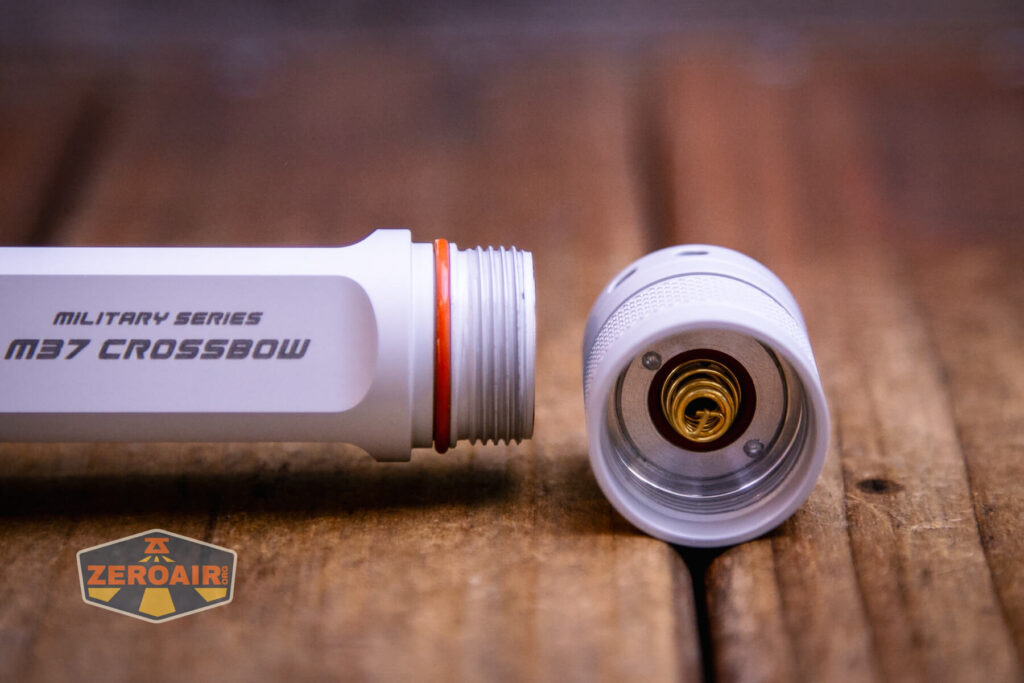 JETBeam M37 Crossbow flashlight tailcap off showing spring and threads
