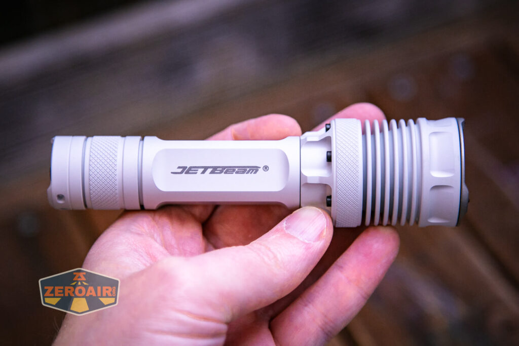 JETBeam M37 Crossbow flashlight in hand
