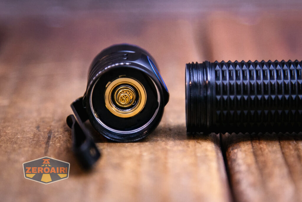 Olight Warrior Nano flashlight contacts in head