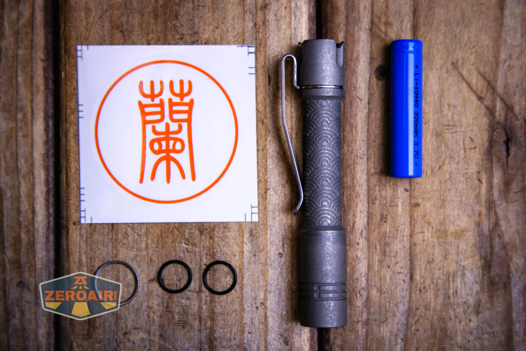 ReyLight Pineapple Mini Seigaiha flashlight in titanium what's included
