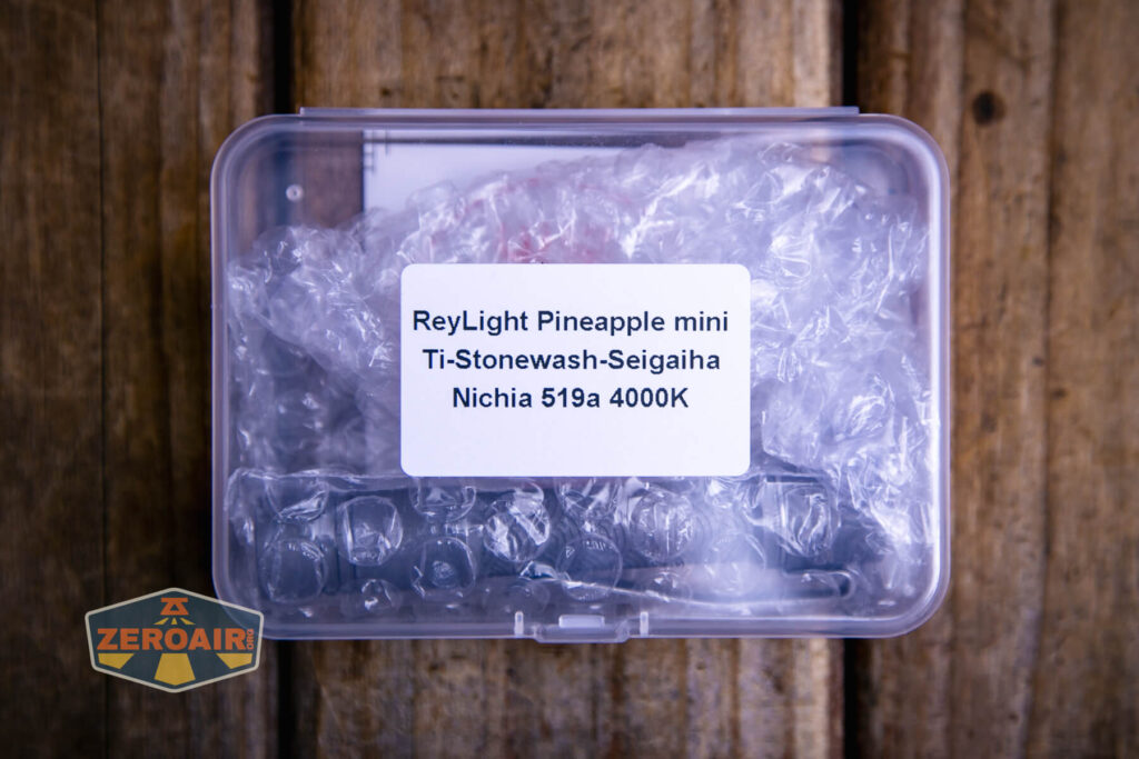 ReyLight Pineapple Mini Seigaiha flashlight in titanium package