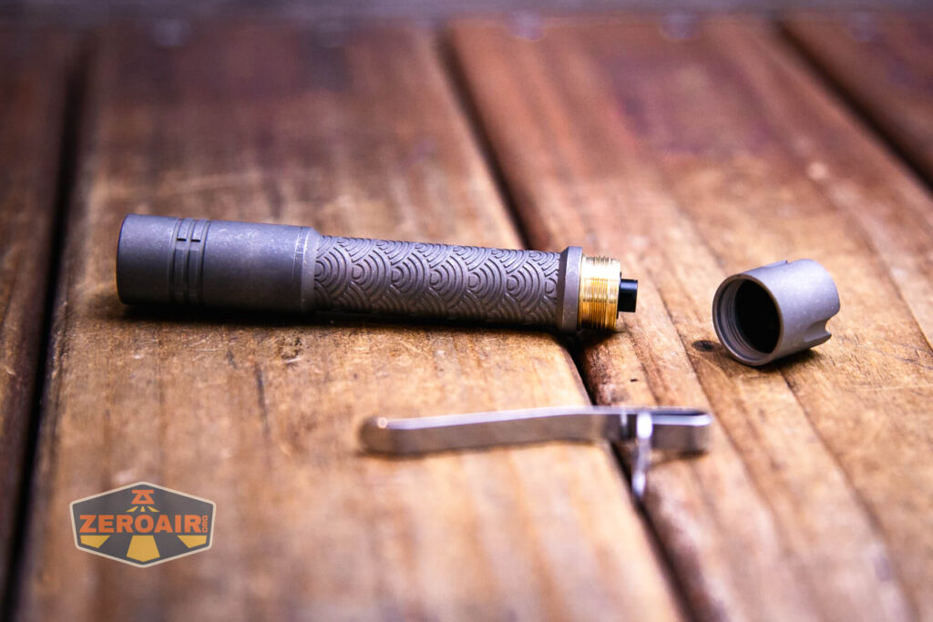 ReyLight Pineapple Mini Seigaiha flashlight in titanium with tailcap unscrewed