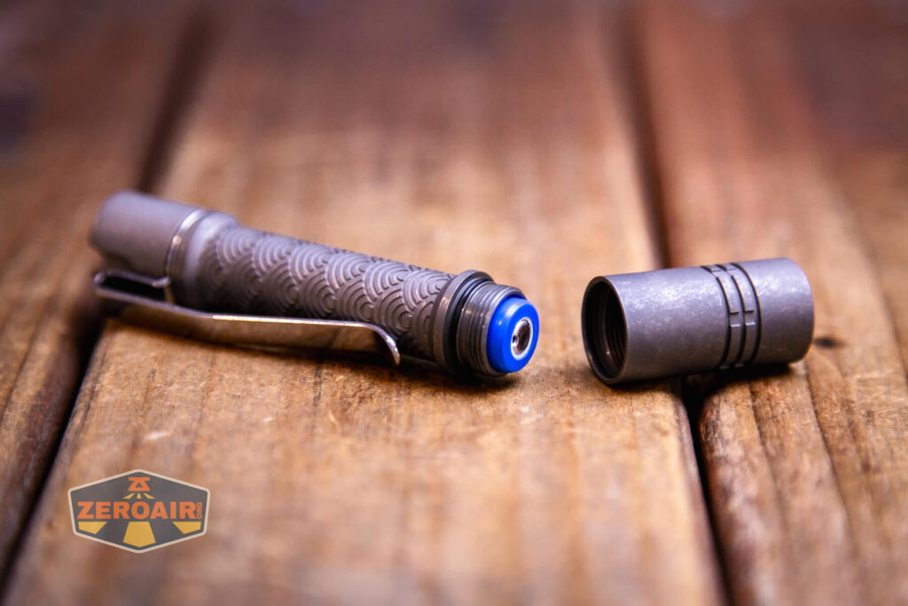 ReyLight Pineapple Mini Seigaiha flashlight in titanium with cell installed