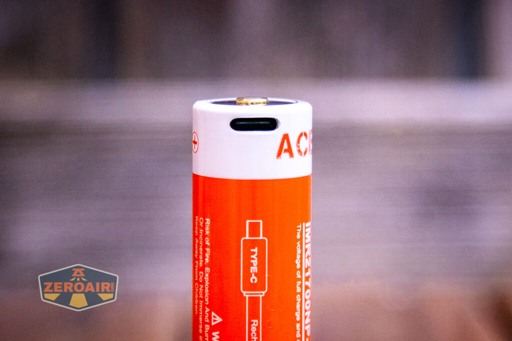 Acebeam Terminator M1 flashlight charging port on cell