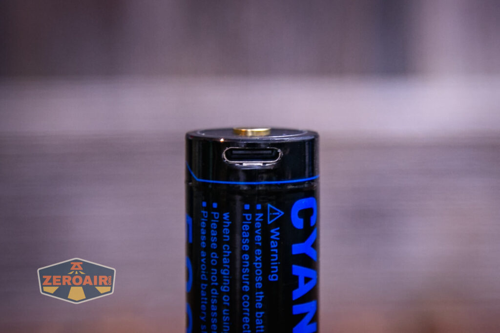 Cyansky Hunter multi-color flashlight charging port on cell