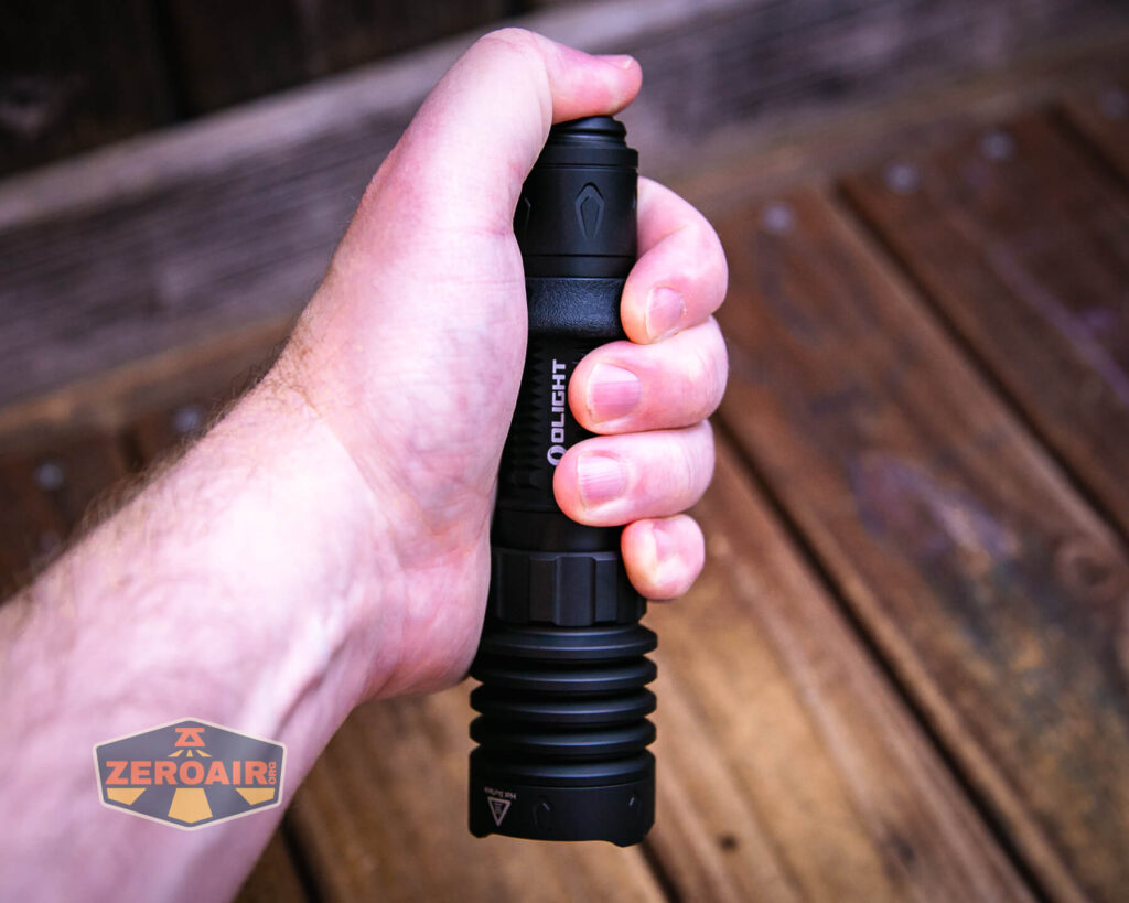 Olight Warrior X 4 tactical flashlight in hand