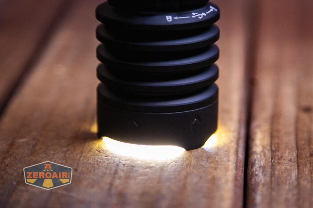 Olight Warrior X 4 tactical flashlight shaped bezel