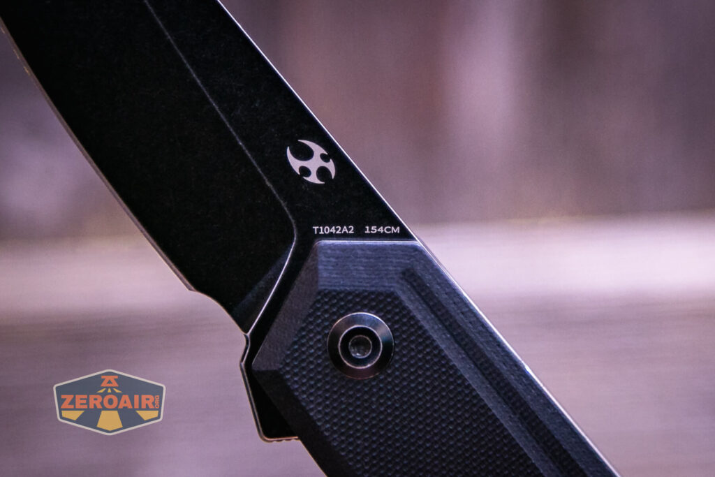 Kansept Integra flipper knife blade steel detail branding