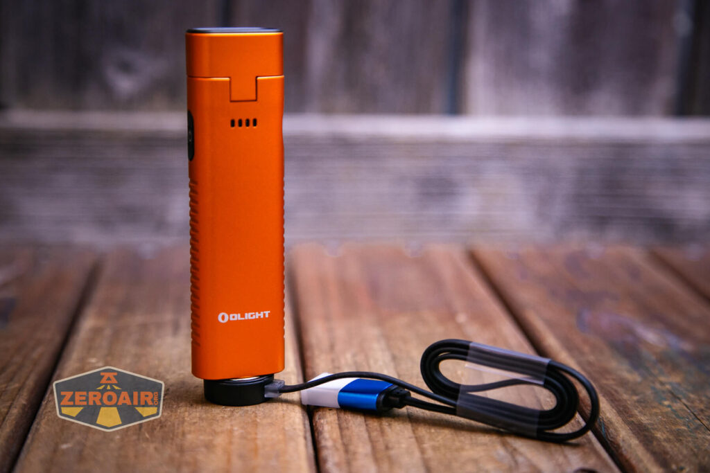 Olight Arkflex adjustable flashlight on charging base