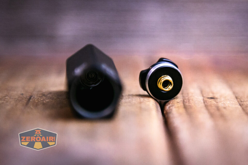 Olight Diffuse 14500 EDC flashlight showing both springs