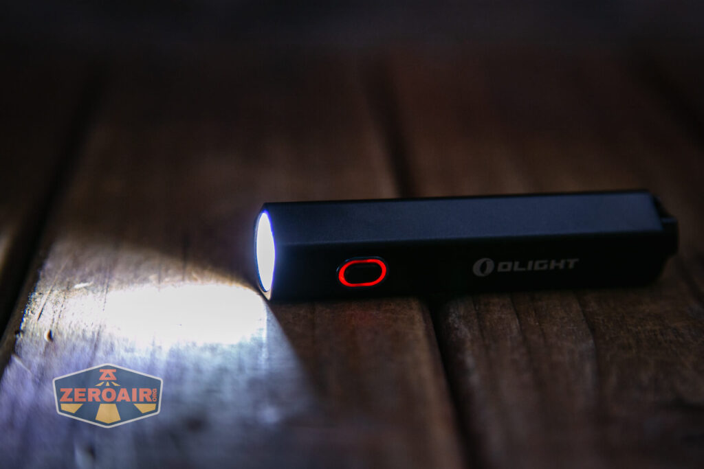 Olight Diffuse 14500 EDC flashlight switch lit in red 