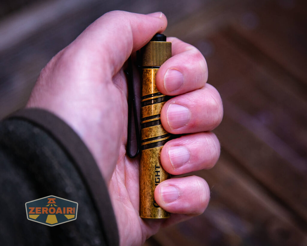 Olight i3T 2 EOS flashlight in hand