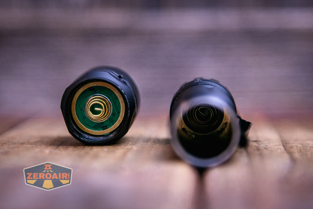 Wurkkos TD03 tactical flashlight showing both springs