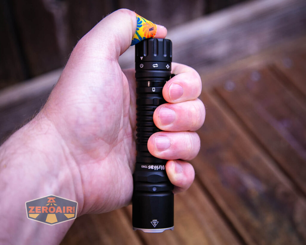 Wurkkos TD03 tactical flashlight in hand