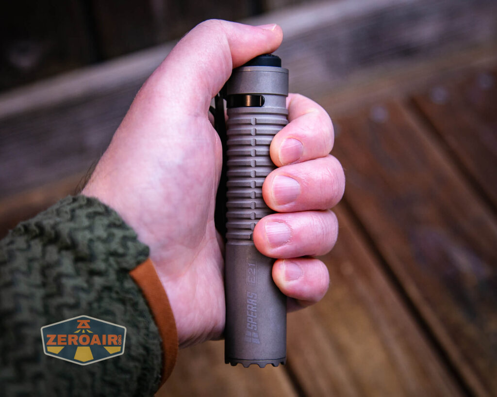 Speras E21 Titanium flashlight in hand